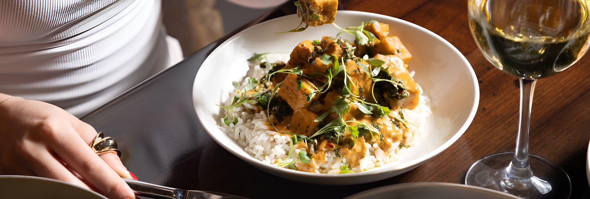 A guest enjoys a flavorful dish at Square 1682 in Philadelphia, PA.