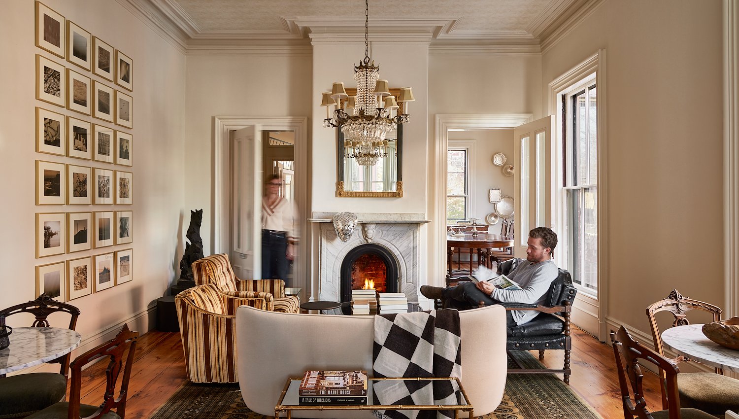 Carleton Street living room with a fireplace and stylish furniture at Blind Tiger Portland, ME