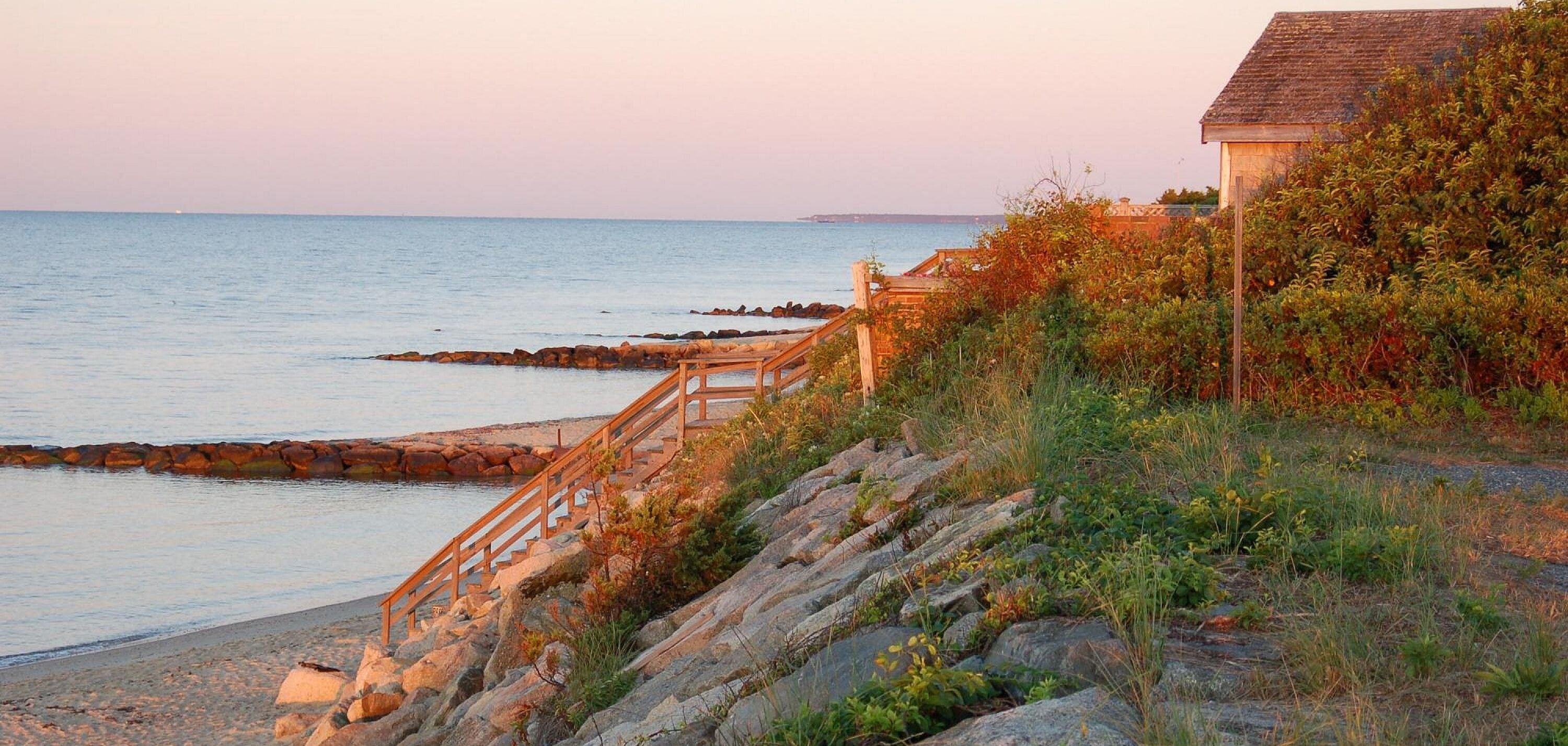 Coastal view in Dennisport MA with a beach and stairs to the sand