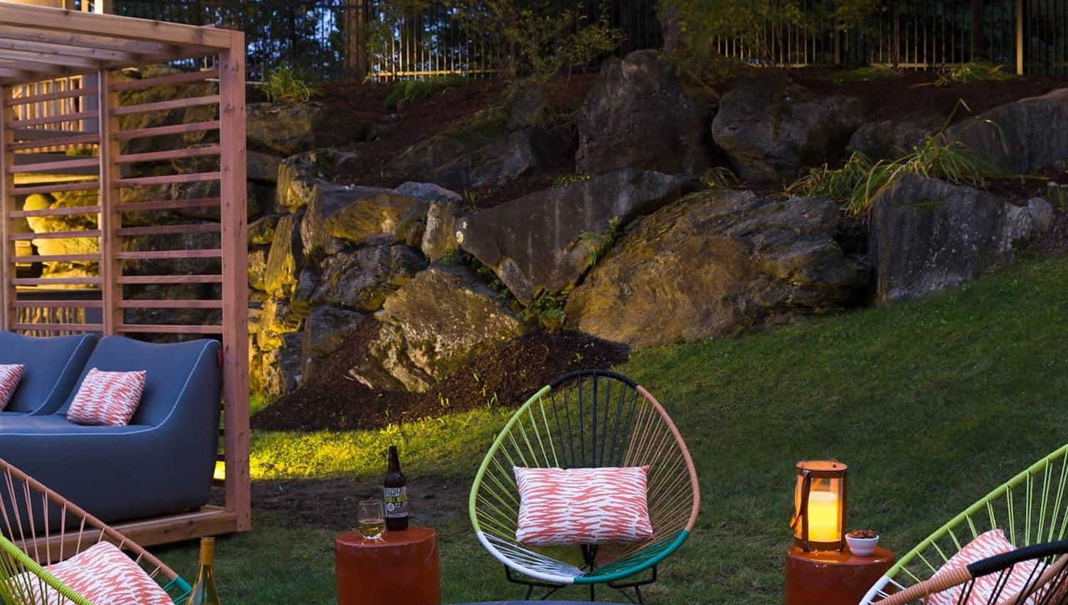 Fire pit nestled in a grassy area, inviting for friends and family to gather around for warmth and conversation