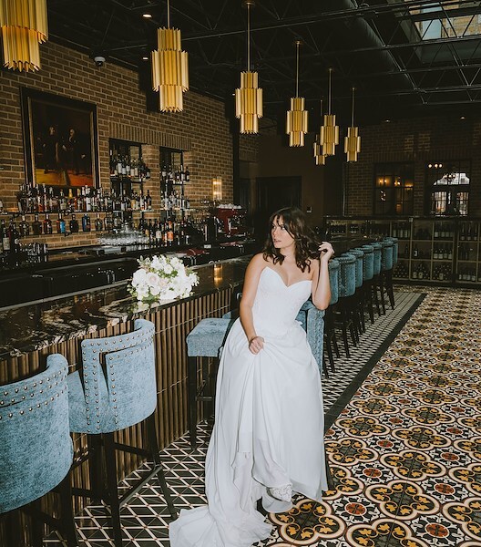 bride posing at The Faust Hotel bar room