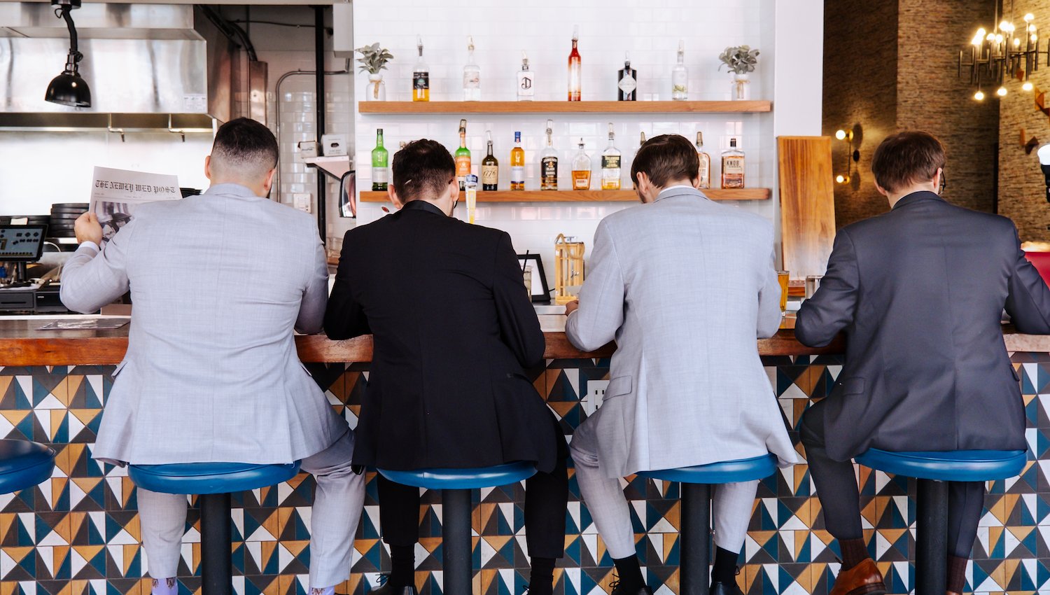 Groomsmen having drinks at the bar in The Hotel Salem, MA