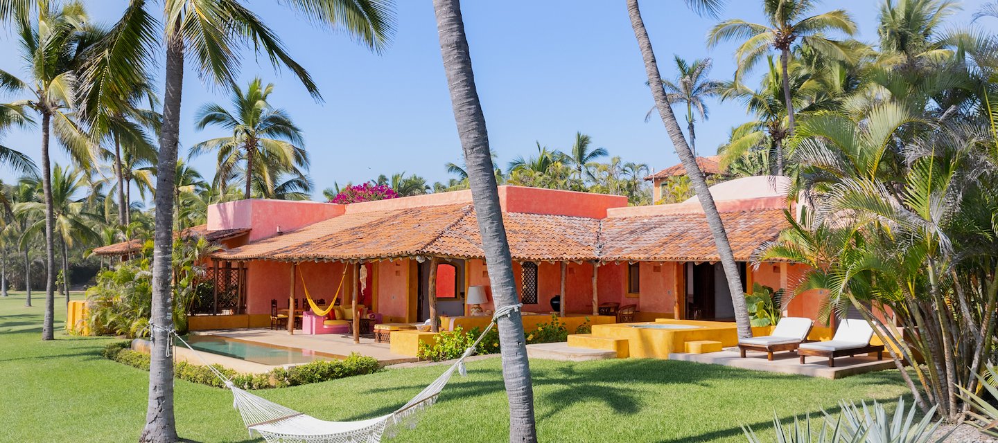 An outdoor veranda with corner sofa Casa del Sol Las Alamandas Resort