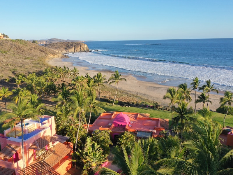 colorful villas in front of a beach in the Pacific