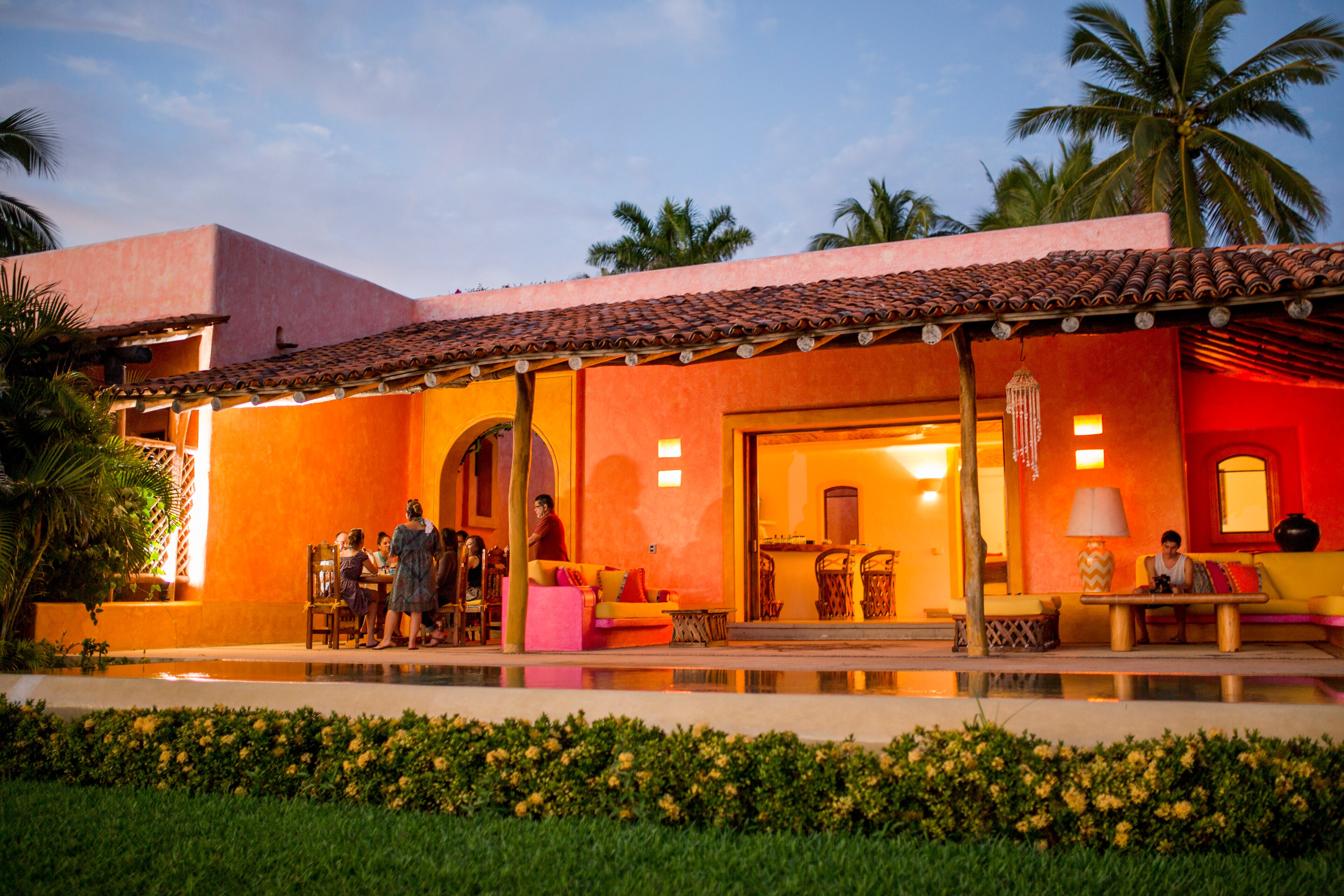 An outdoor veranda with corner sofa Casa del Sol Las Alamandas Resort