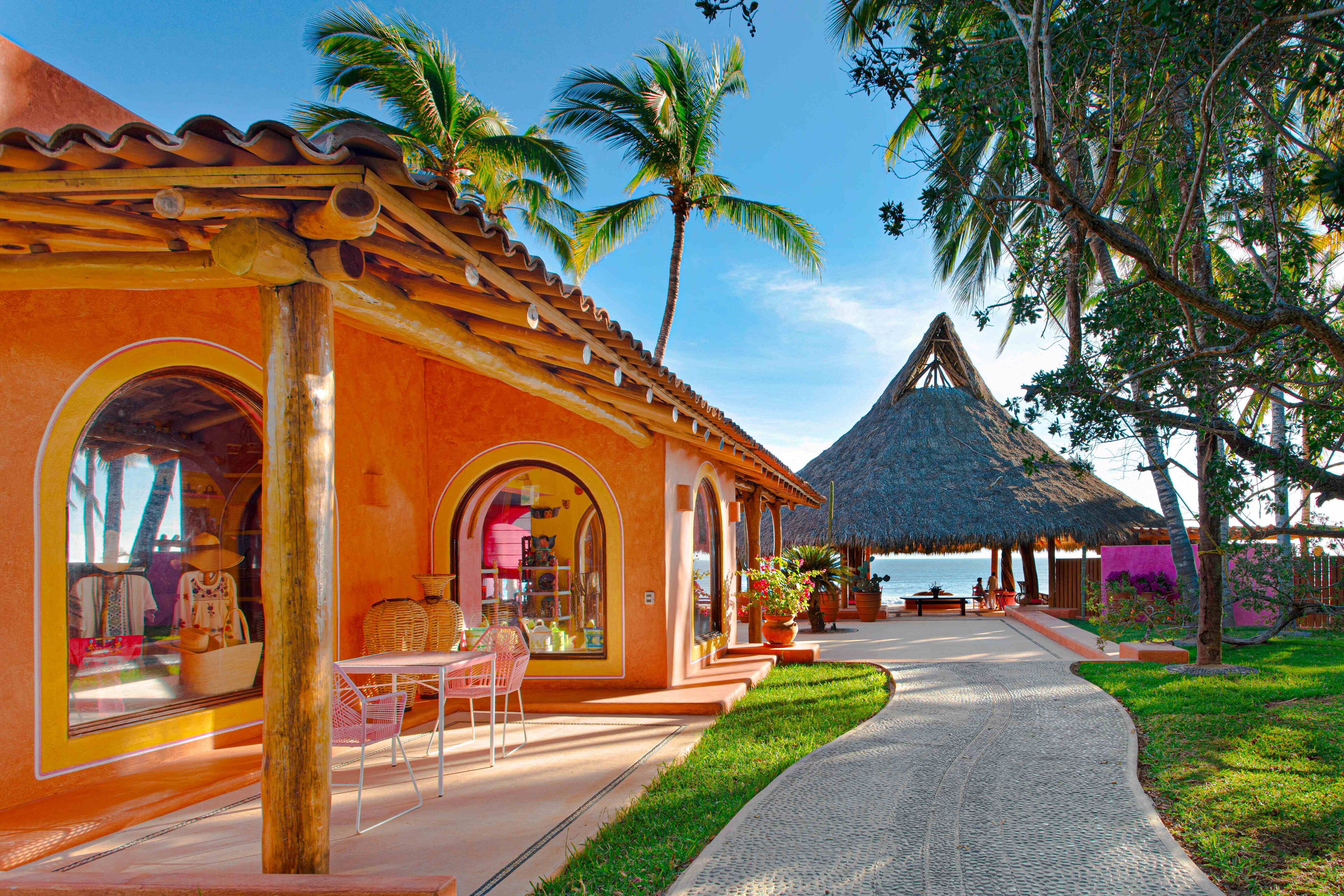 The path leads to a vibrant area at Las Alamandas Resort in Jalisco