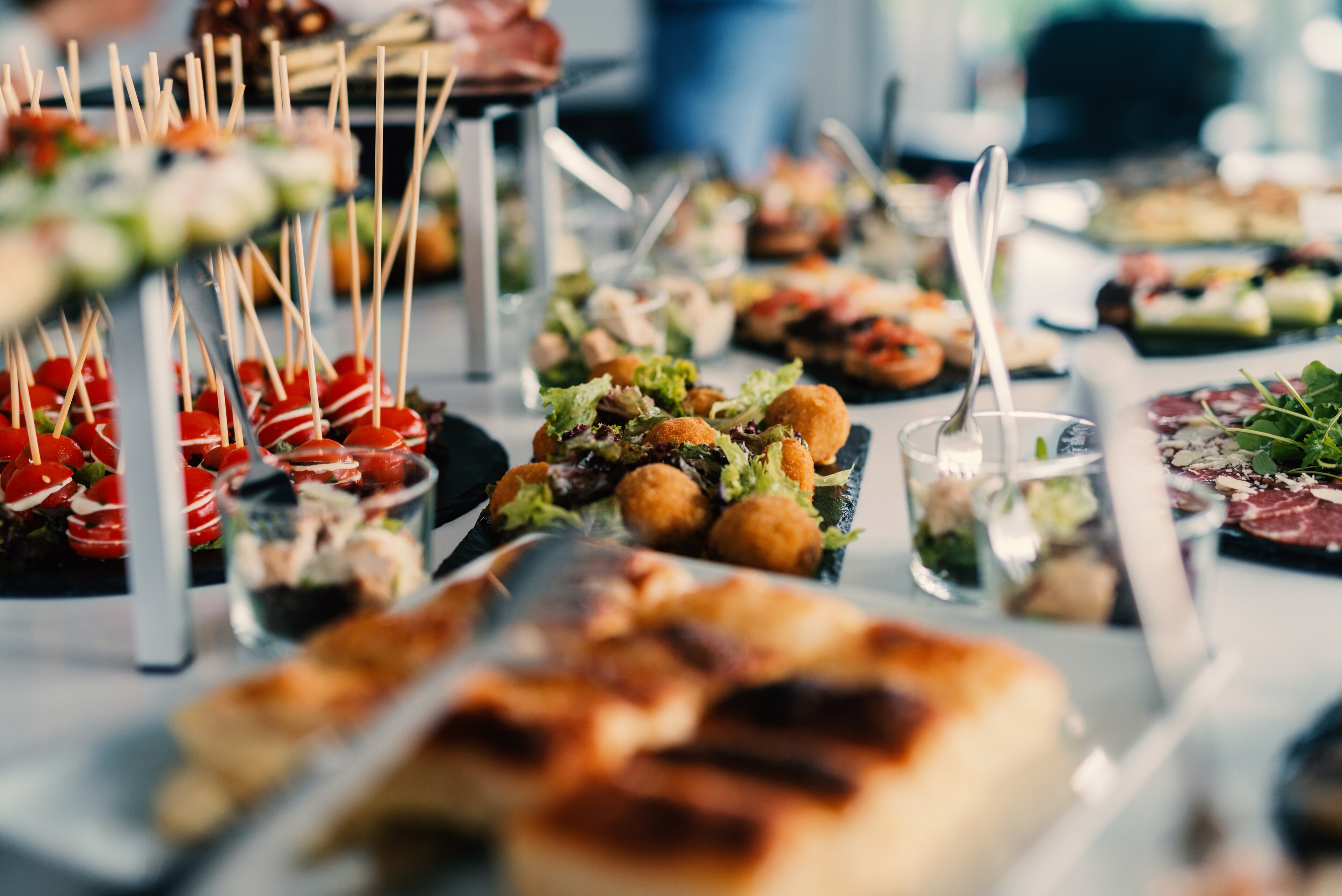 A colorful buffet table with an array of food options