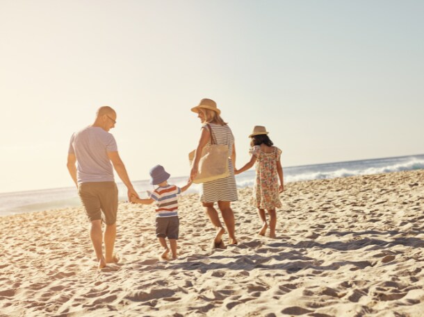 A family on the beach in Tybee Island, GA