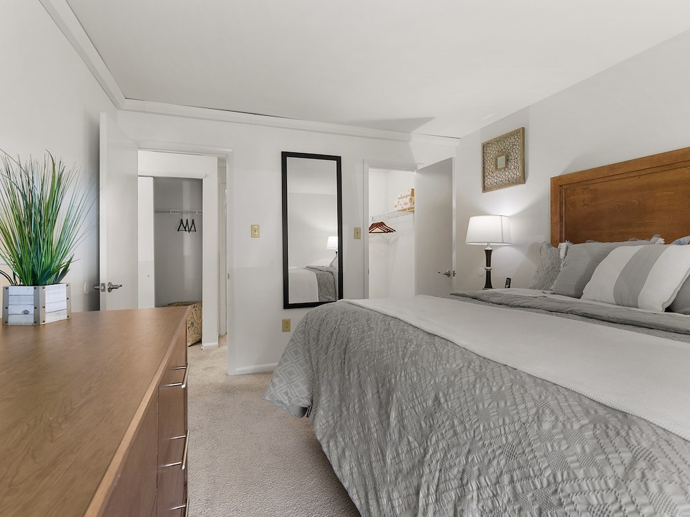 Spacious bedroom at California Apartments, shown in the two-bedroom floor plan with extensive closet space.