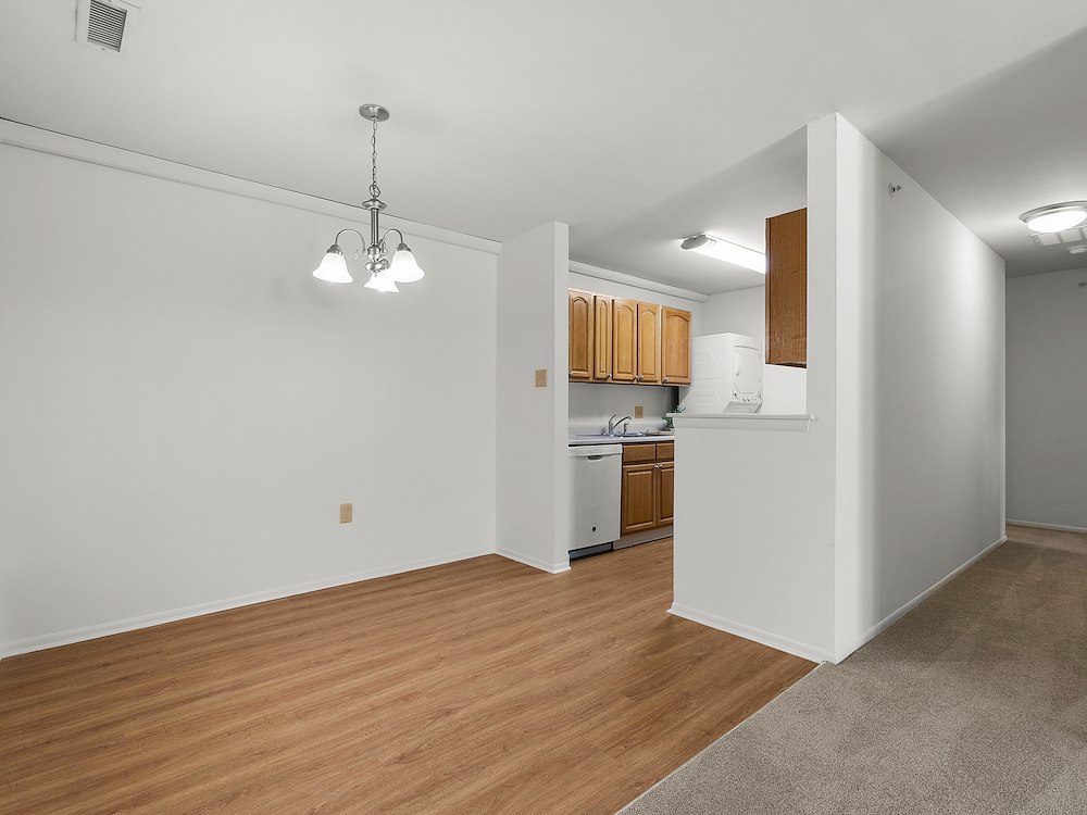 Spacious dining room in a one-bedroom apartment at California Apartments, featuring our vinyl plank flooring option.