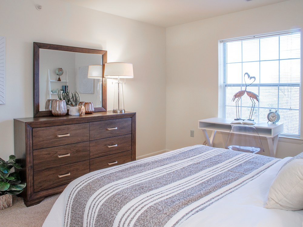 Spacious bedroom at California Apartments, shown in the two-bedroom floor plan with extensive closet space.