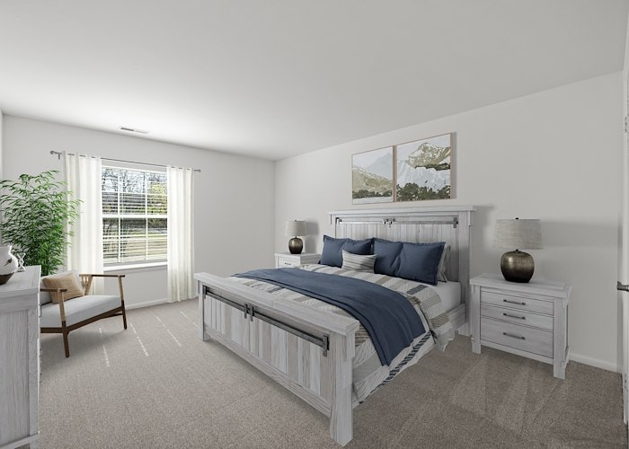 A bedroom with a bed, dresser and window at California Apartments in Absecon, New Jersey