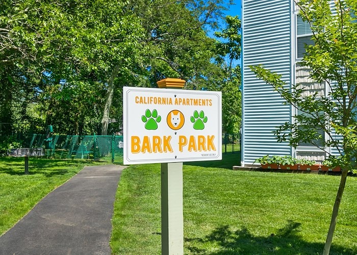 A sign for bark park in front of an apartment building at California Apartments in Absecon, New Jersey