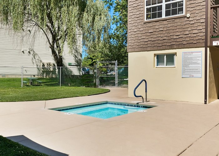 A small pool in the backyard of a house at California Apartments in Absecon, New Jersey