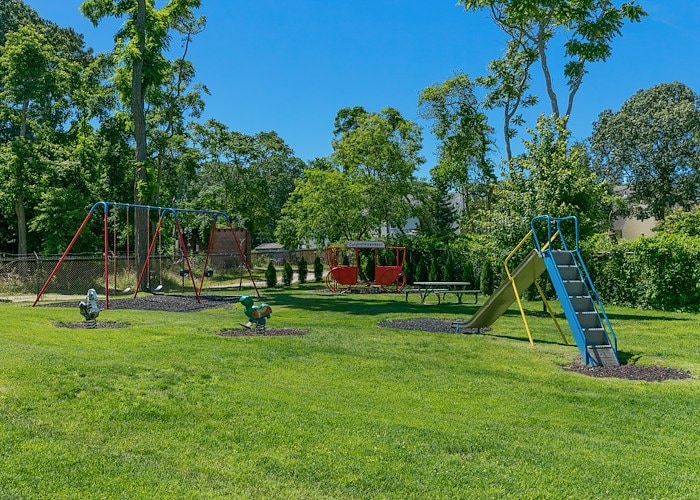 Playground at the park at the village at the ridge at California Apartments in Absecon, New Jersey