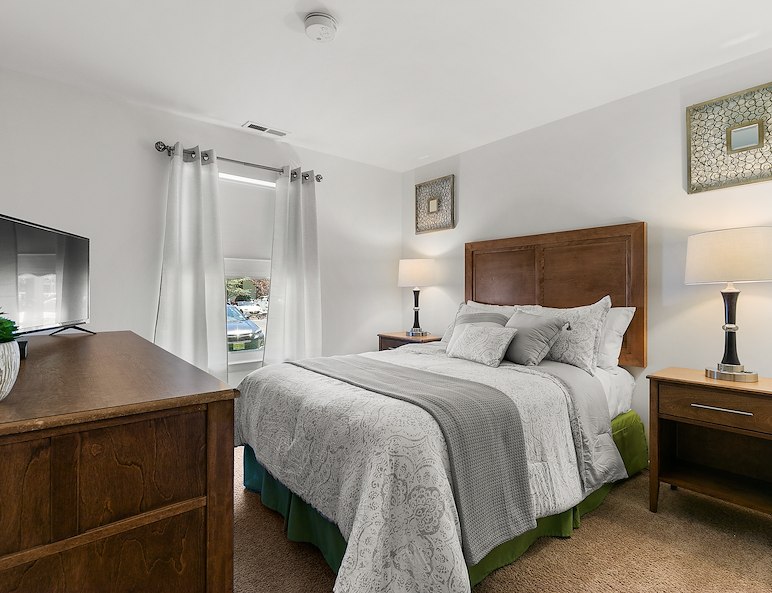 Bedroom with dresser California Apartments