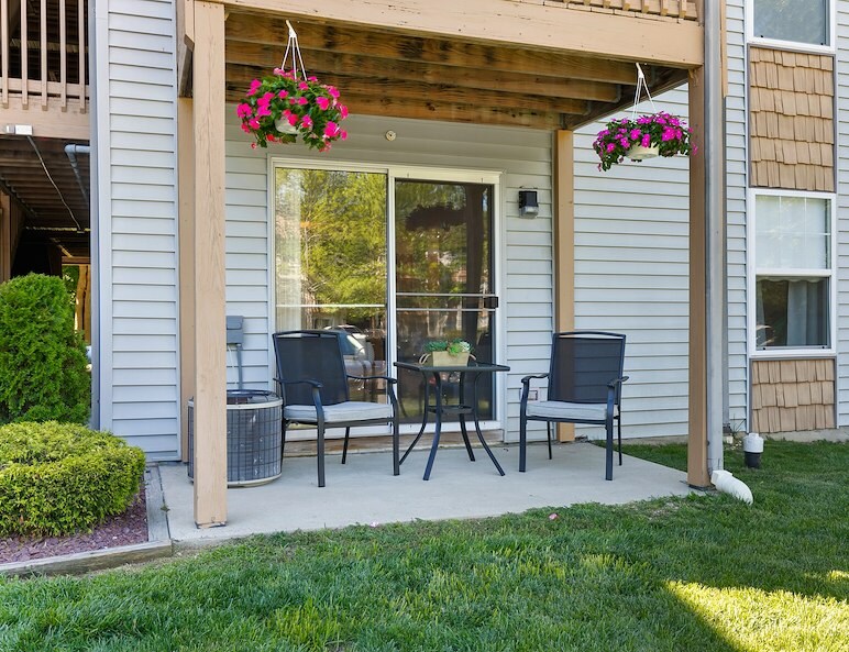 A patio with table and chairs California Apartments