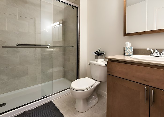 A bathroom with a shower stall and toilet, Country Club Apartments, Huntington, West Virginia