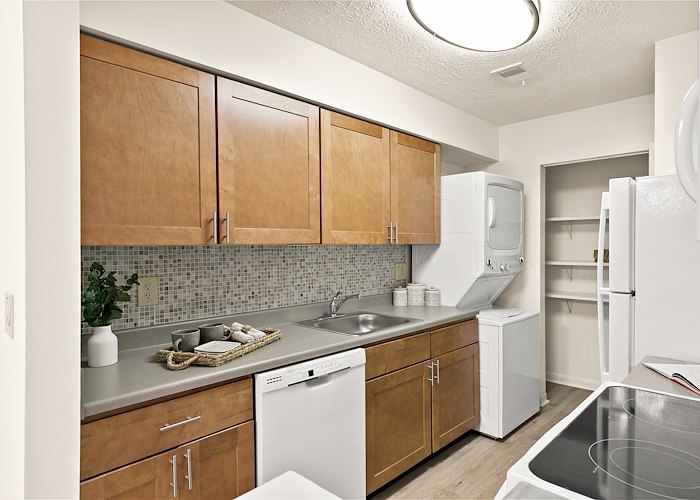 A kitchen with a refrigerator, stove and dishwasher, Country Club Apartments, Huntington, West Virginia