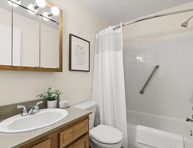A bathroom with a shower, toilet, sink and mirror, Country Club Apartments, Huntington, West Virginia