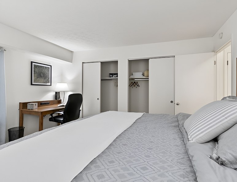 Premium Quality Furniture A bedroom with a bed, dresser, and television, Country Club Apartments, Huntington, West Virginia