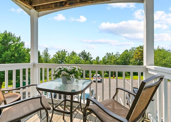 A balcony with two chairs and a table, East Mountain Apartments, Wilkes-Barre, Pennsylvania