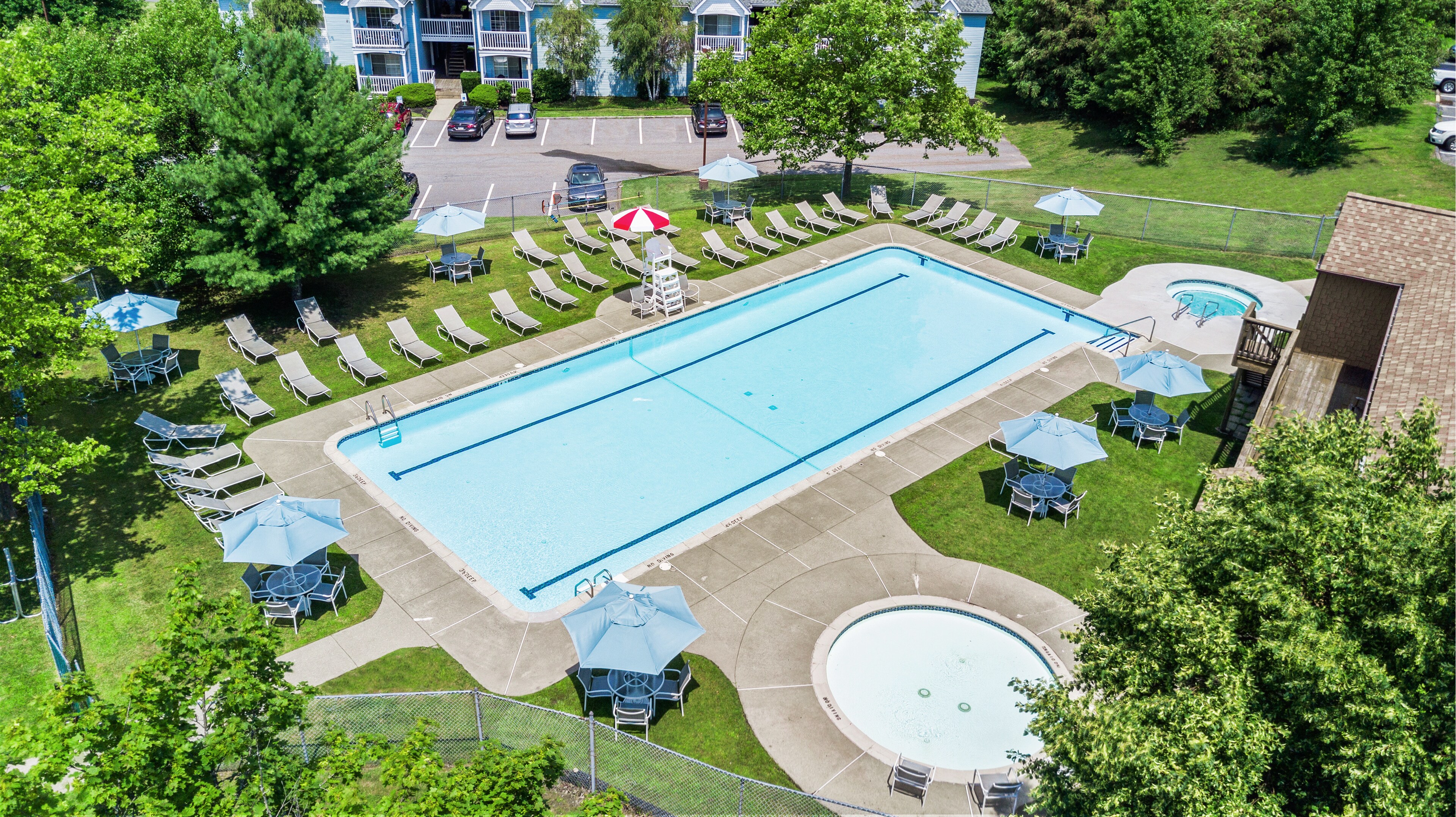 Outdoor swimming pool at East Mountain Apartments by Manor Communities in Wilkes-Barre, PA