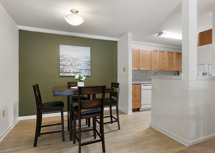 A kitchen and dining room with a table and chairs, East Mountain Apartments, Wilkes-Barre, Pennsylvania