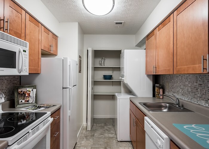 A kitchen with a refrigerator, stove, microwave and sink, East Mountain Apartments, Wilkes-Barre, Pennsylvania