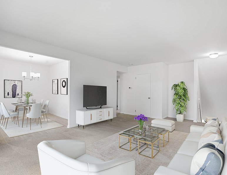 living room with couch, table, and chair at Gateway Apartments in Edwardsville, PA