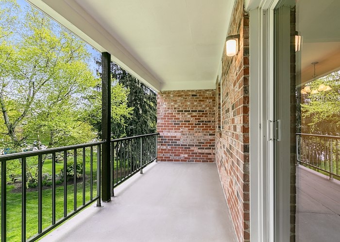 A balcony with a railing and a door at Gateway Apartments in Edwardsville, Pennsylvania