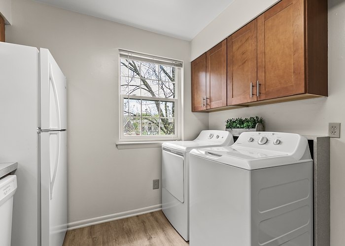 A laundry room with washer and dryer in it at Gateway Apartments in Edwardsville, Pennsylvania