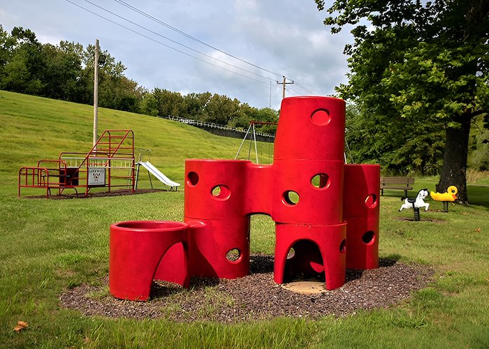 A red play structure in a park at Gateway Apartments in Edwardsville, Pennsylvania