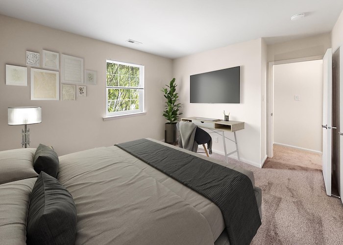 A bedroom with a bed, desk and tv, Grampian Hills Apartments, Williamsport, Pennsylvania