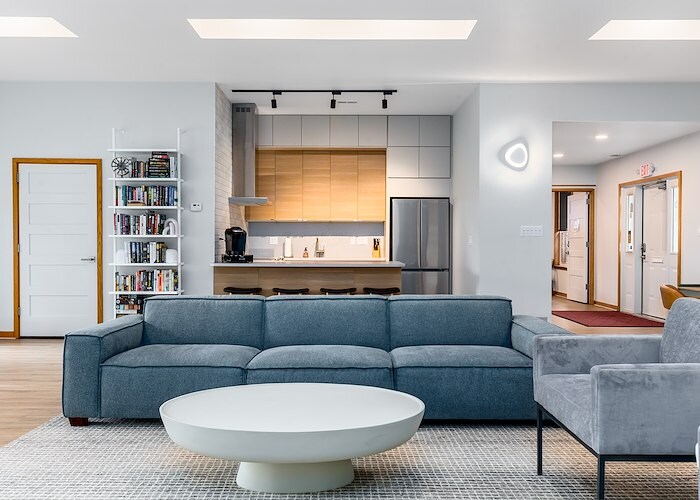 A living room with a couch, coffee table and a kitchen, Grampian Hills Apartments, Williamsport, Pennsylvania
