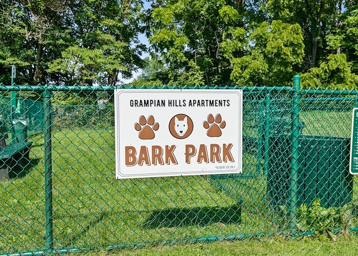 A sign for bark park is on a chain link fence, Grampian Hills Apartments, Williamsport, Pennsylvania