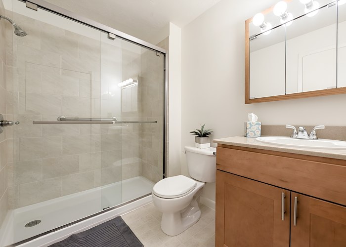 A bathroom with a shower stall and toilet, Grampian Hills Apartments, Williamsport, Pennsylvania