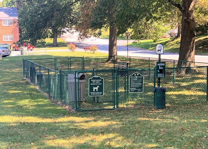 A green fence with a gate and a sign, Manor House Apartments, Lancaster, Pennsylvania