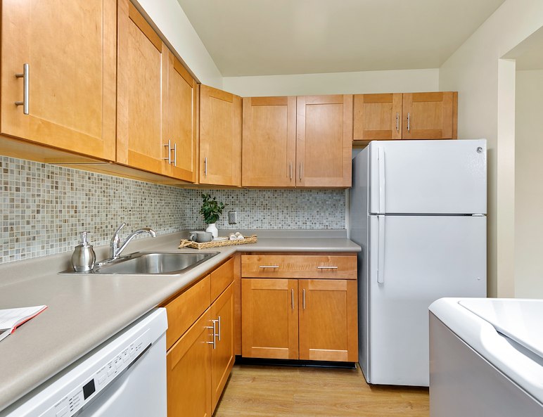 Contemporary kitchen with plank flooring at Manor House Apartments in Lancaster, PA
