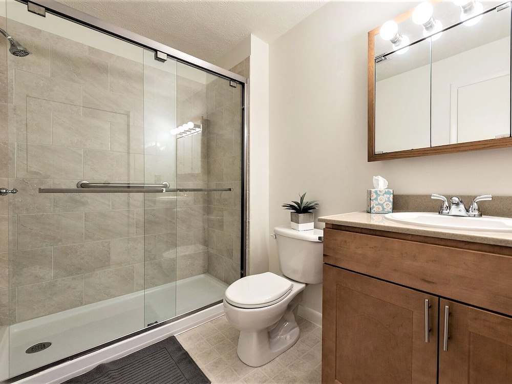 Walk-in shower option available at Manor House Apartments for all apartment sizes, offering a convenient and stylish alternative to a traditional bathtub.