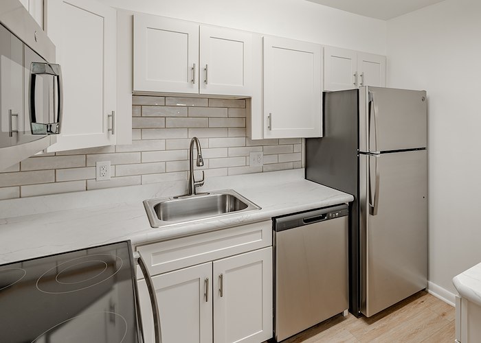 A kitchen with stainless steel appliances and white cabinets, Manor House Apartments, Lancaster, Pennsylvania