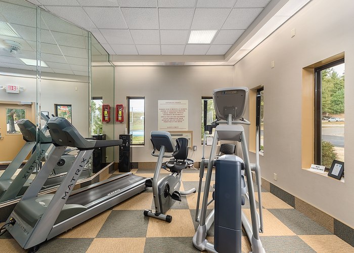A gym room with exercise equipment and mirrors, Pikeview Manor Apartments, Beckley, West Virginia