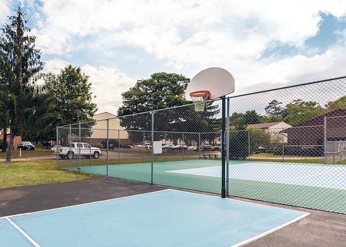 A basketball court with a net and a basketball hoop, Pikeview Manor Apartments, Beckley, West Virginia