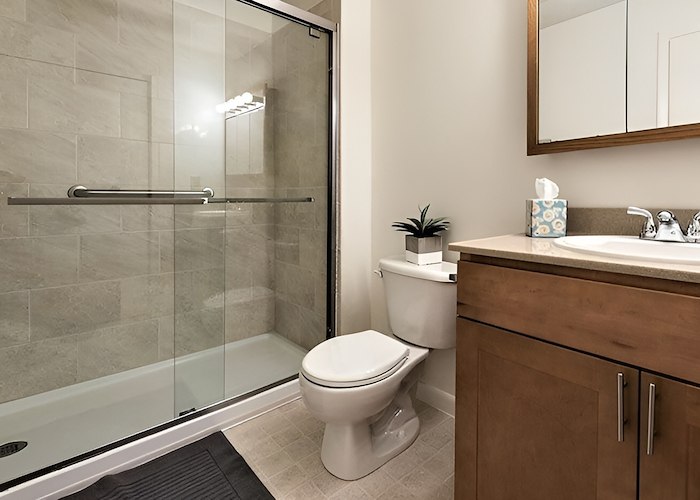 A bathroom with a shower stall and toilet, Pikeview Manor Apartments, Beckley, West Virginia