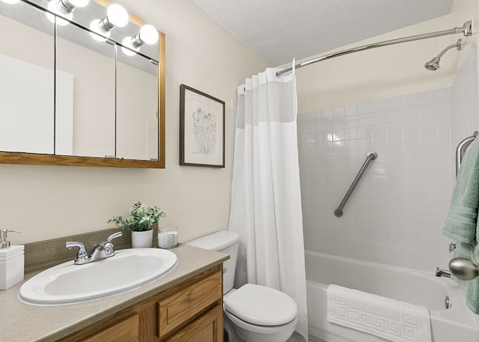 A bathroom with a shower, toilet, sink and mirror, Pikeview Manor Apartments, Beckley, West Virginia