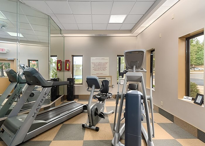 A gym room with exercise equipment and mirrors, Pikeview Manor Apartments, Beckley, West Virginia