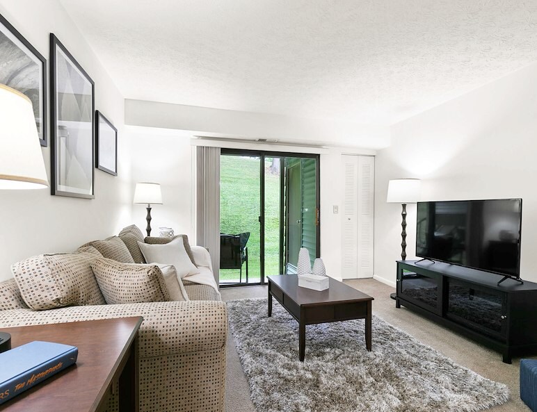 Furnished living room with TV at Pikeview Manor Apartments in Beckley, WV