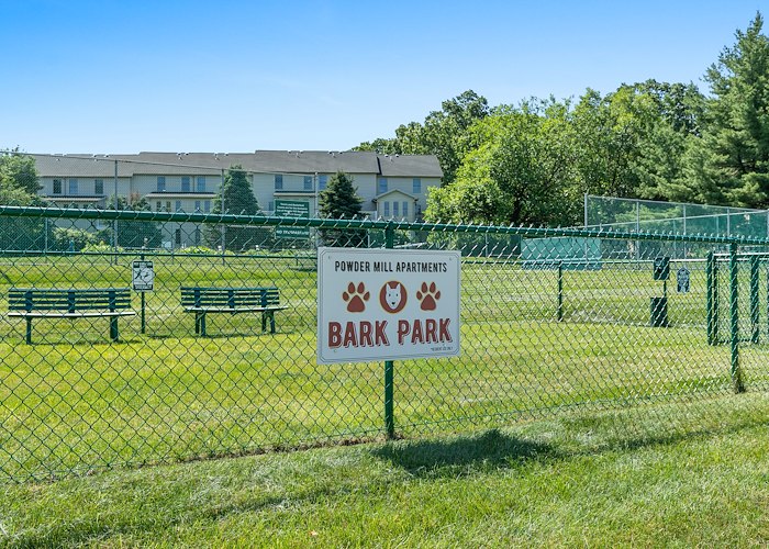 A dog park with a fence and signs, Powder Mill Apartments, York, Pennsylvania
