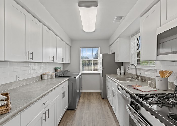 A kitchen with white cabinets and a stove, Powder Mill Apartments, York, Pennsylvania