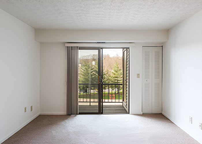 A room with a sliding glass door and a balcony, Roxalana Apartments, Dunbar, West Virginia
